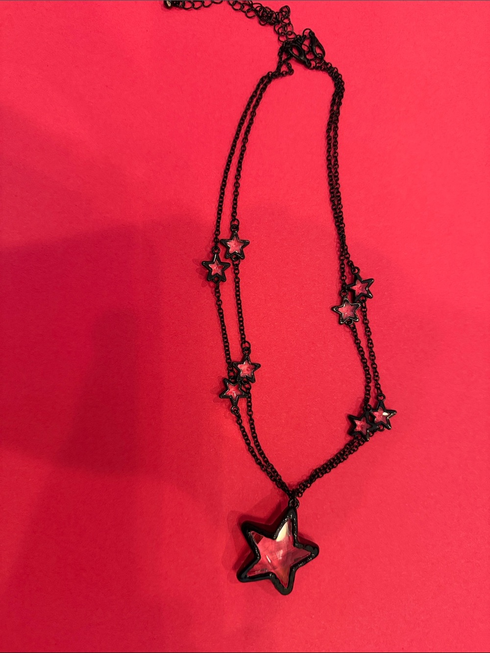 Black Star Pendant Necklace with Pink Accent